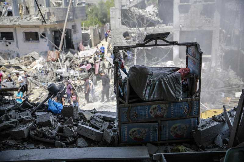 A child's bed seen at the site of destroyed house in the aftermath of Israeli air and artillery strikes as cross-border violence between the Israeli military and Palestinian militants continues in the northern Gaza Strip.