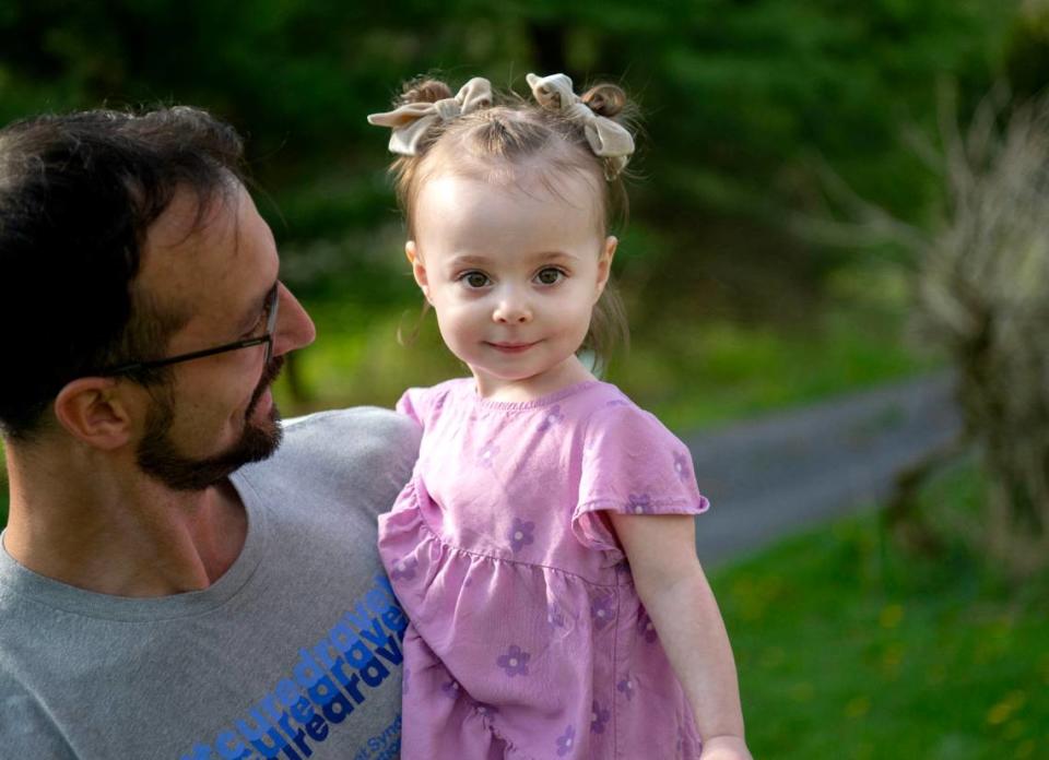 Freya Barragan smiles as she plays outside with her dad Adrian on Tuesday, April 30, 2024. Freya has Dravet syndrome, which causes seizures. Abby Drey/adrey@centredaily.com