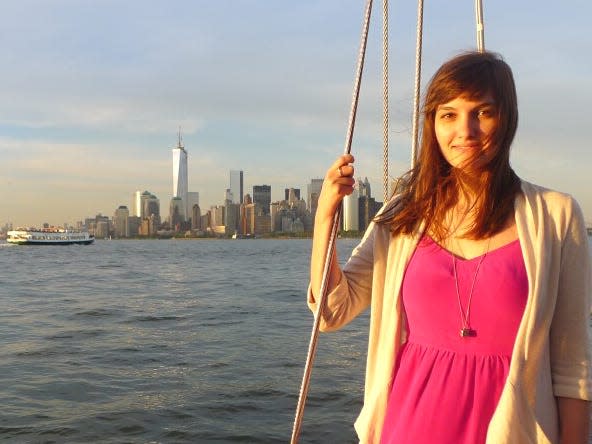 Author Lydia Warren in front of the NYC city skyline in 2013.