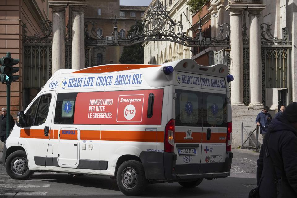An ambulance is driven past the St. Anna gate, one of the entrances to the Vatican, Friday, March 6, 2020. The Vatican confirmed the walled city-state's first case of the new coronavirus Friday and closed some offices as a precaution while Pope Francis continued recovering from a cold. (AP Photo/Andrew Medichini)