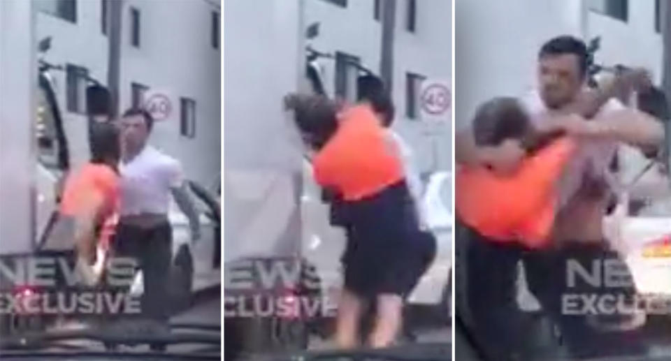 The two men trade blows in the middle of Parramatta Road. Source: 7News