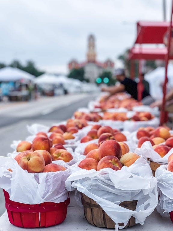 Peaches sit ready to sell at the Parker County Peach Festival.