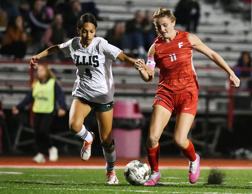 Freedom's Shaye Bailey and Ellis' Sonia Palit fight for the ball during Tuesday night's Class 1A WPIAL playoff game at Freedom Area High School.