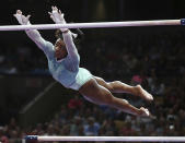 <p>In this Aug. 19, 2018 photo, Simone Biles competes on the uneven bars at the U.S. Gymnastics Championships in Boston. </p>