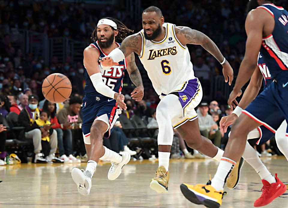 LOS ANGELES, CA - DECEMBER 25:   DeAndre' Bembry #95 of the Brooklyn Nets strips the ball from LeBron James #6 of the Los Angeles Lakers in the second half of the game at Crypto.com Arena on December 25, 2021 in Los Angeles, California. NOTE TO USER: User expressly acknowledges and agrees that, by downloading and/or using this Photograph, user is consenting to the terms and conditions of the Getty Images License Agreement.   (Photo by Jayne Kamin-Oncea/Getty Images)