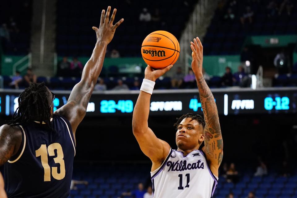 Mar 17, 2023; Greensboro, NC, USA; Kansas State Wildcats forward Keyontae Johnson (11) shoots against Montana State Bobcats forward Jubrile Belo (13) in the second half at Greensboro Coliseum. Mandatory Credit: John David Mercer-USA TODAY Sports