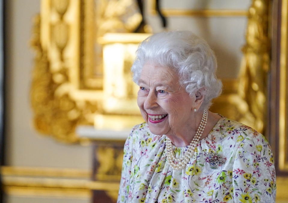 <p>A smiling Queen Elizabeth II views a display of artefacts from British craftwork company, Halcyon Days to commemorate the company's 70th anniversary at Windsor Castle. (Reuters)</p> 