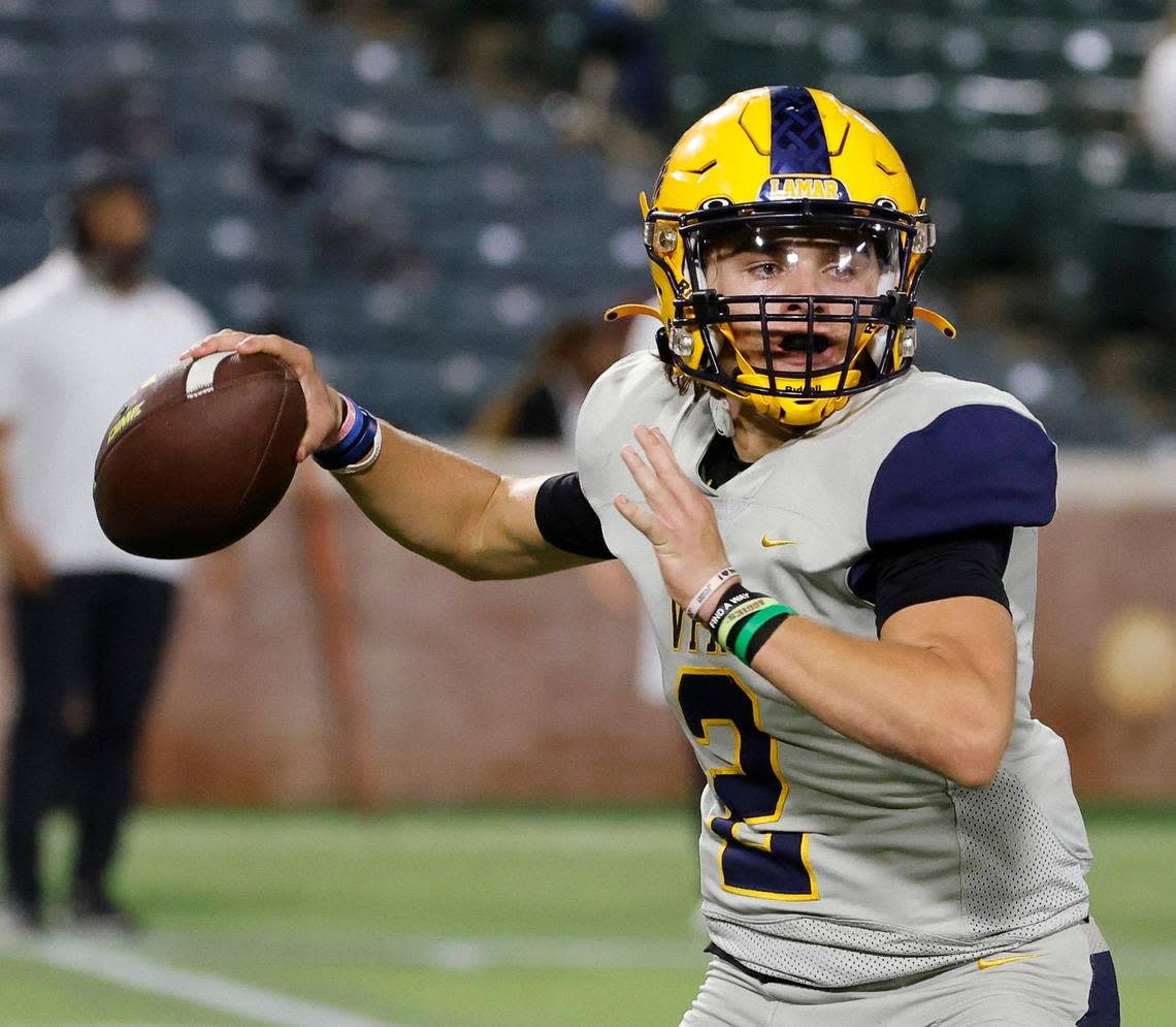 Arlington Lamar quarterback Gannon Carey (2) tosses a short pass to the sidelines in the first half of a UIL high school football game on Thursday, October 26, 2023 at Choctaw Stadium in Arlington, Texas.