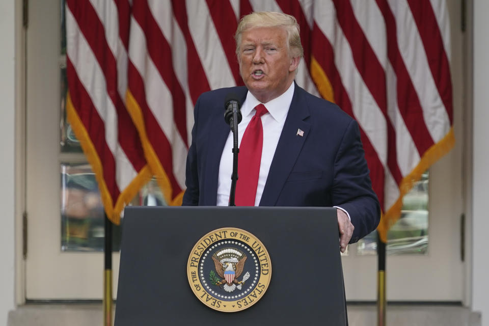 FILE - In this Tuesday, May 26, 2020 file photo, President Donald Trump answers questions from reporters during an event on protecting seniors with diabetes in the Rose Garden White House in Washington. On Tuesday, Twitter took the unprecedented step of adding fact-check alerts to two of Trump’s tweets about voting by mail. The next day the president threatened social media companies with new regulation or even shuttering. (AP Photo/Evan Vucci, File)