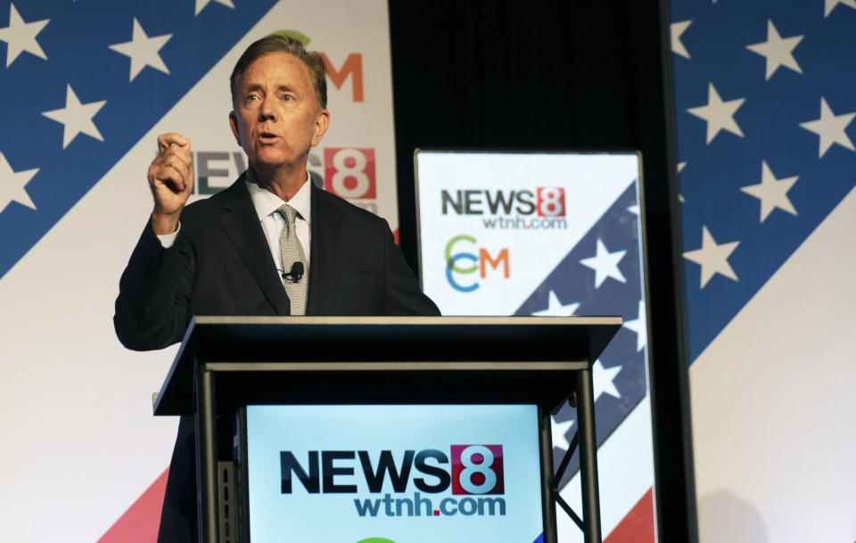 In this photo provided by WTNH, Democratic Connecticut Gov. Ned Lamont speaks during a gubernatorial debate with Republican challenger Bob Stefanowski and Rob Hotaling, a candidate on the Connecticut Independent Party ticket, Tuesday, Nov. 1, 2022, in Uncasville, Conn. (Anthony Quinn/WTNH via AP)