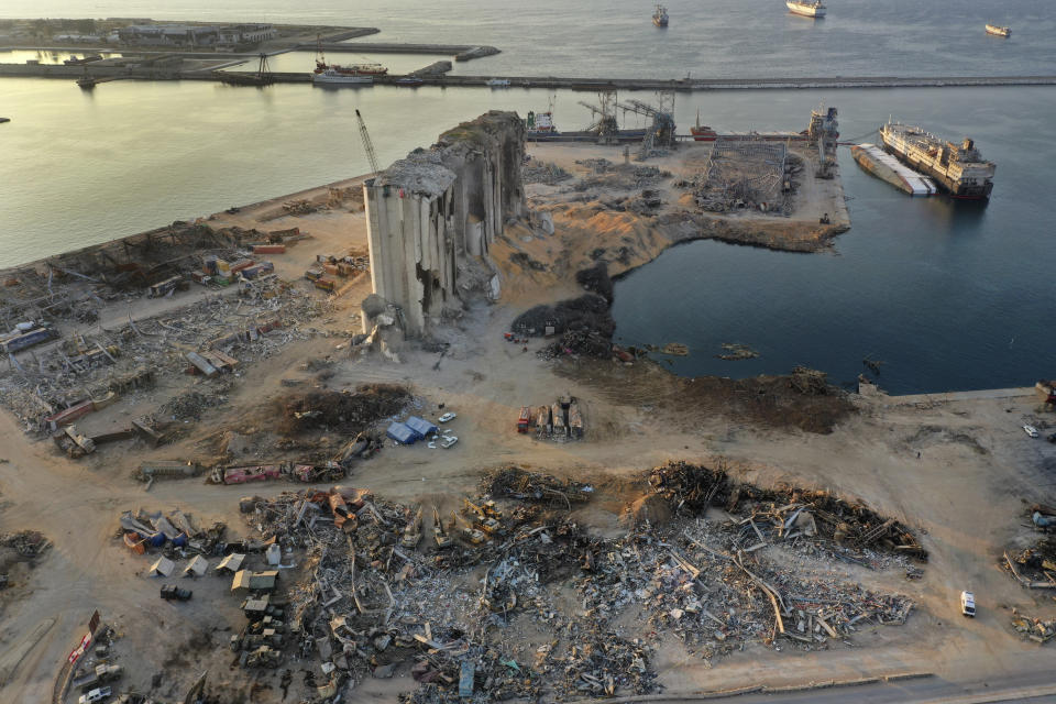 This Aug. 29, 2020 photo shows rubble and debris around the silo that was destroyed by Aug. 4 explosion that hit the seaport of Beirut, Lebanon. The Lebanese military discovered more than 4 tons of ammonium nitrate near Beirut's port on Thursday, Sept. 3, a find that's a chilling reminder of the horrific explosion. (AP Photo/Hussein Malla)
