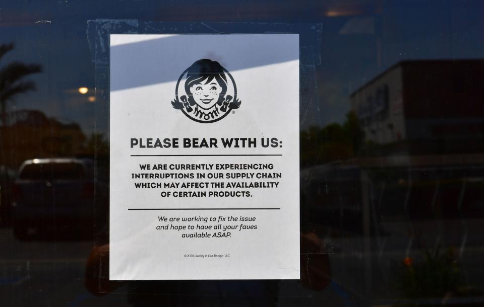 A sign posted on a walk-in entrance to a Wendy's fast food restaurant in Alhambra, California on May 5, 2020. - A sign displayed on the walk-in entrance mentions an interruption in supply chain affecting availability of certain products. Wendy's, an international chain restaurant famous for the 1984 catchphrase "Where's the Beef?" is experiencing a beef shortage caused by the coronavirus pandemic, as some restaurants stop serving burgers. (Photo by Frederic J. BROWN / AFP) (Photo by FREDERIC J. BROWN/AFP via Getty Images)