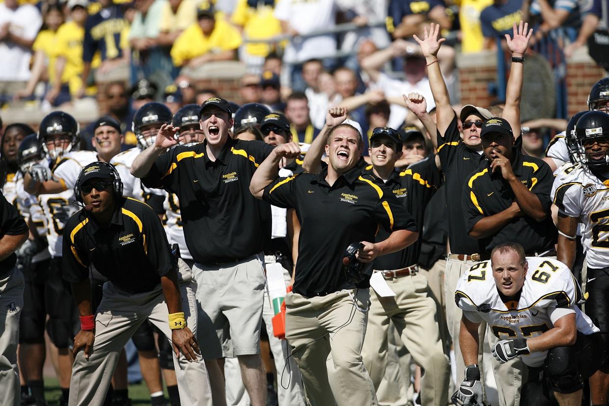 The Mountaineers celebrate after beating Michigan. (Leon Halip/Getty Images)