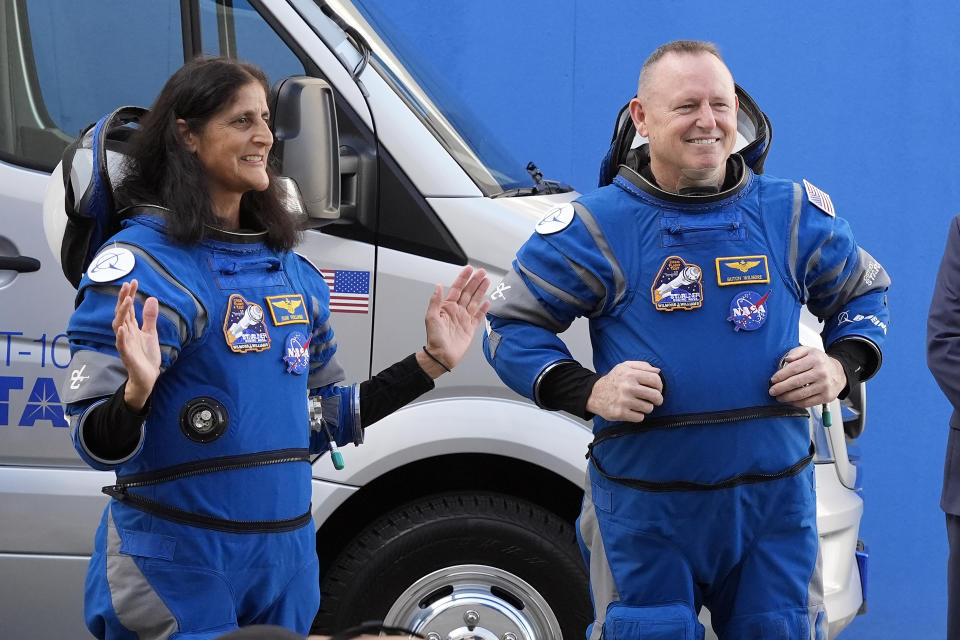 NASA astronauts Suni Williams, left, and Butch Wilmore talk to family members as they leave the operations and checkout building for a trip to launch pad at Space Launch Complex 41 Saturday, June 1, 2024, in Cape Canaveral, Fla. The two astronauts are scheduled to liftoff later today on the Boeing Starliner capsule for a trip to the international space station. . (AP Photo/John Raoux)