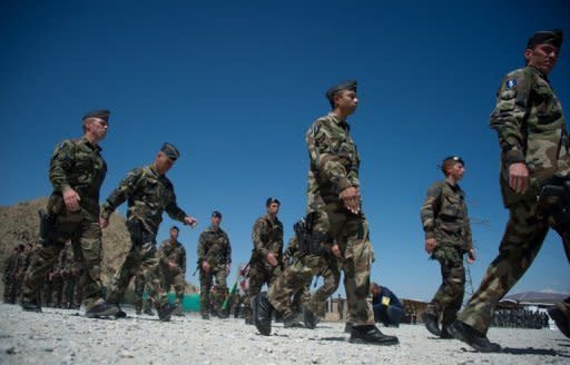 This file photo shows French soldiers gathering during a transition ceremony with Afghan troops at Surobi base, in April. French President Francois Hollande arrived in Kabul on Friday for talks with his Afghan counterpart and to tell French troops why he will pull them out of the war-torn country by the end of 2012 -- two years ahead of NATO allies