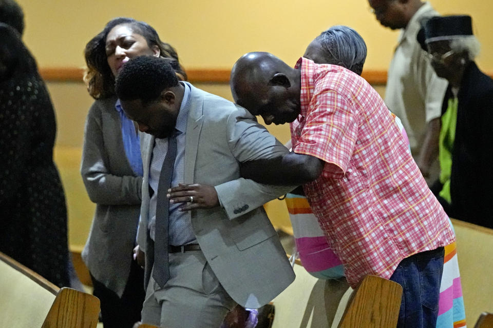 Parishioners pray during a service for the victims of a mass shooting at the St. Paul A.M.E. Church, Sunday, Aug. 27, 2023, in Jacksonville, Fla. (AP Photo/John Raoux)