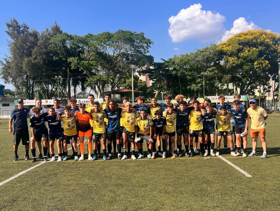 The Booker T. Washington boys soccer team poses with a local team from Brazil that the Wildcats played over Thanksgiving break in Brazil during "The Brazilian Soccer Experience."