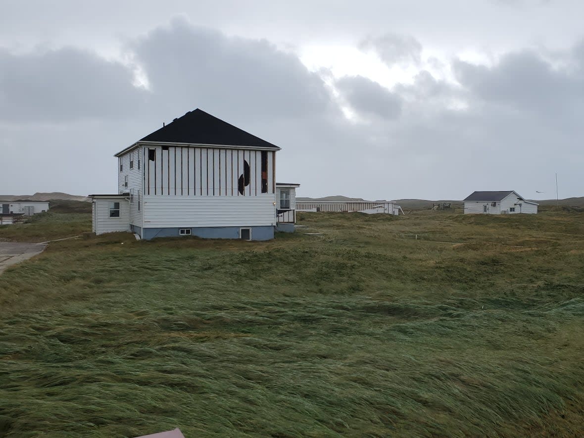 One side of a building on Sable Island is missing siding after post-tropical storm Fiona. (Jason Surette/Parks Canada - image credit)