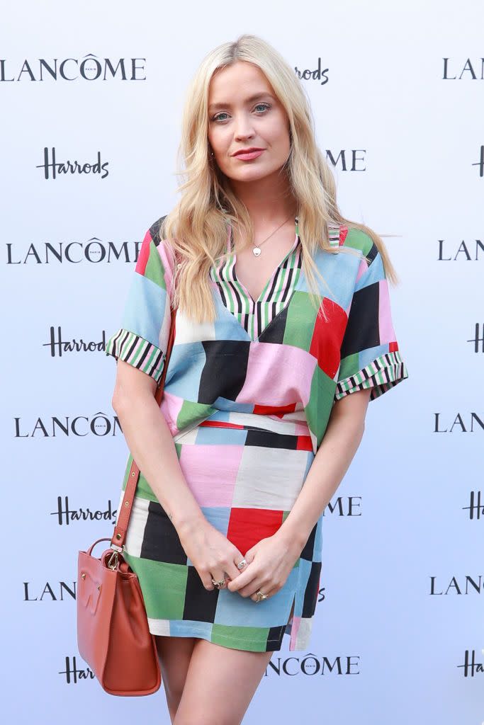 laura whitmore at an event wearing a colourful patchwork dress
