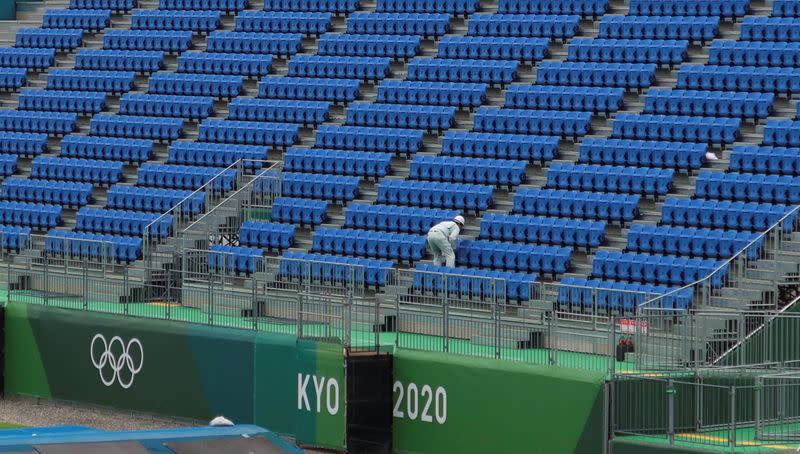 A worker inspects seats at Tokyo2020 Olympic BMX Track in preparation for the Tokyo 2020 Olympic Games in Tokyo