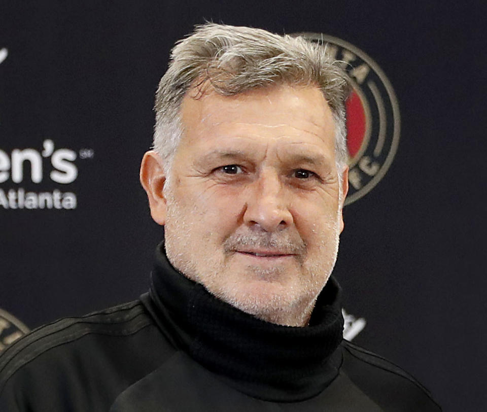 FILE - This is a Feb. 15, 2018, file photo showing Atlanta United MLS soccer team head coach Gerardo "Tata" Martino, during a news conference in Marietta, Ga. Coach Tata Martino is leaving Atlanta United at the end of the MLS season. United made the announcement Tuesday, Oct. 23, 2018, saying Martino turned down an offer to extend his two-year contract beyond 2018. (AP Photo/David Goldman, File)