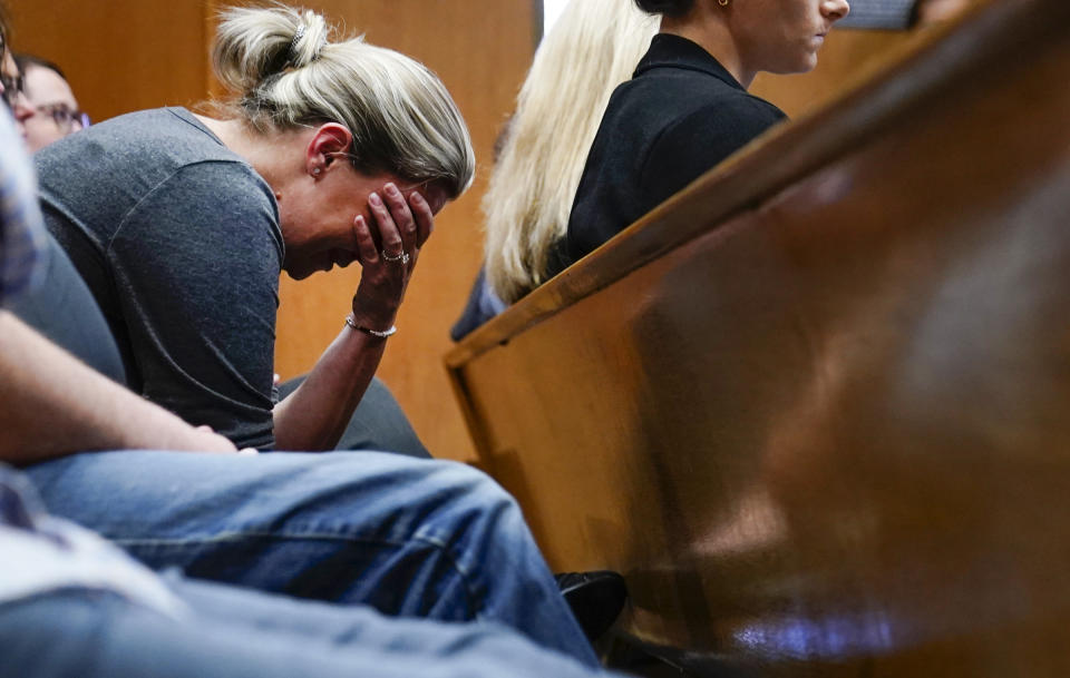 Nicole Beausoleil mother of Madisyn Baldwin, who was killed in a mass shooting at Oxford High School in 2021, becomes emotional as Oakland County Prosecutor Karen McDonald makes closing statements that include autopsy reports in the trial against James Crumbley on Wednesday, March, 13, 2024 in Pontiac, Mich. Crumbley is charged with involuntary manslaughter, accused of failing to secure a gun at home and ignoring his son's mental health. Ethan Crumbley killed four students at Oxford High School in 2021. (Mandi Wright/Detroit Free Press via AP, Pool)