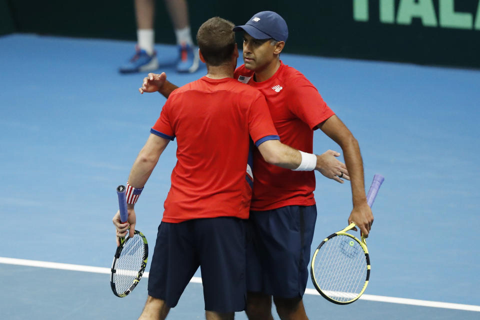 Rajeev Ram, right, and Austin Krajicek of the USA celebrate their victory over Illya Beloborodko and Oleksii Krutykh of Ukraine during a Davis Cup qualifier doubles tennis match between Ukraine and USA, in Vilnius, Lithuania, Friday, Feb. 2, 2024. (AP Photo/Mindaugas Kulbis)