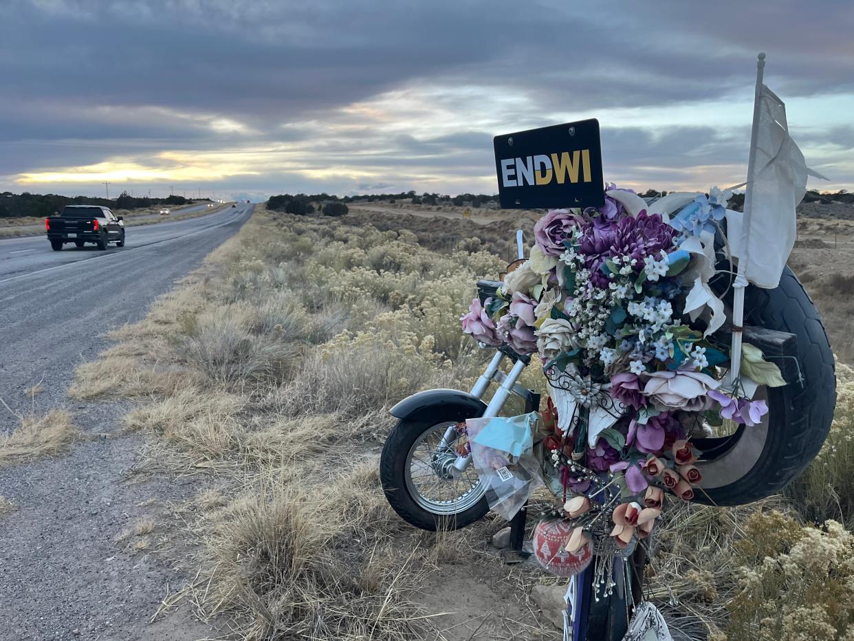 A memorial along New Mexico Highway 264 honors Janella Bryant, a motorcyclist who was killed by a drunken driver in September 2020.