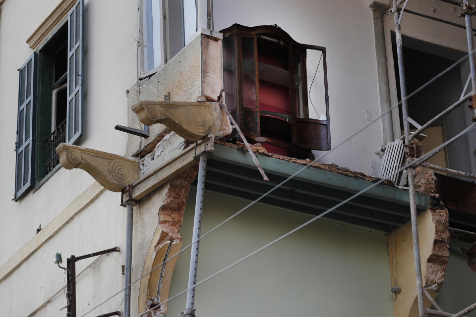 A broken glass display cabinet is seen at a heritage house that was destroyed by Aug. 4 explosion that hit the seaport of Beirut, in Lebanon, Thursday Aug. 27, 2020. In the streets of Beirut historic neighborhoods, workers are erecting scaffolding to support buildings that have stood for more than a century - now at risk of collapse after the massive Aug. 4 explosion that tore through the capital. (AP Photo/Hussein Malla)