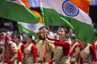 Assamese girls and boys in traditional attire carry Indian flags as they perform Bihu dance on Independence Day in Gauhati, northeastern Assam state, India, Monday, Aug. 15, 2022. The country is marking the 75th anniversary of its independence from British rule. (AP Photo/Anupam Nath)