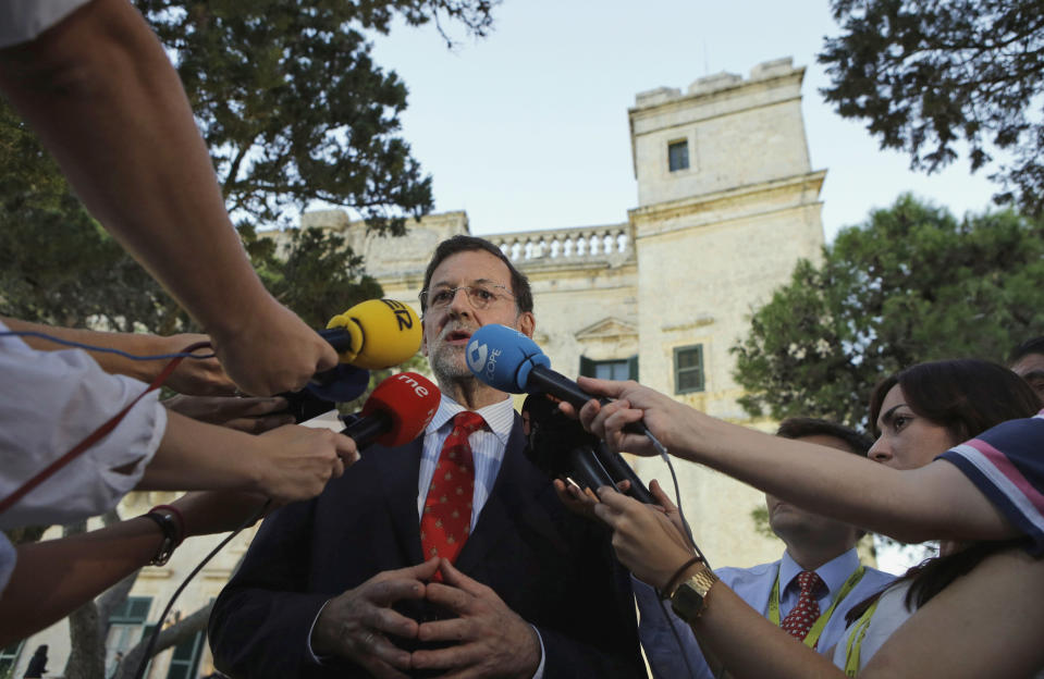 Spain's Prime Minister Mariano Rajoy addresses the press as he attends a Mediterranean summit of southern European and North African countries, in Valletta, Malta, Friday, Oct. 5, 2012.The Malta summit of five European and five African nations is expected to focus on fighting terrorism and lawlessness in North African as well as France's push for a military intervention in Mali, where Islamist rebels have taken control in the north. (AP Photo/Andrew Medichini)