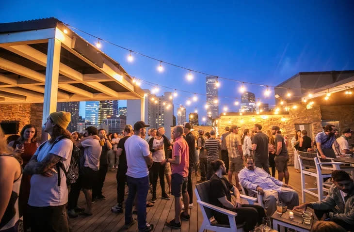 <span class="article__caption">Access to in-person events, like this rooftop party in Denver during Outdoor Retailer, will be one of the Outerverse Passport's many promised benefits. (Photo: Darren Miller)</span>