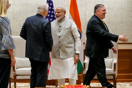 Indian PM Modi shakes hands with U.S. Ambassador to India Juster during Secretary of State Pompeo's visit in New Delhi