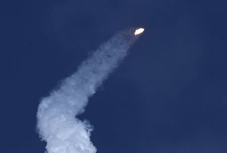 A SpaceX Falcon Heavy rocket trails smoke after lifting off from historic launch pad 39-A at the Kennedy Space Center in Cape Canaveral, Florida, U.S., February 6, 2018. REUTERS/Joe Skipper