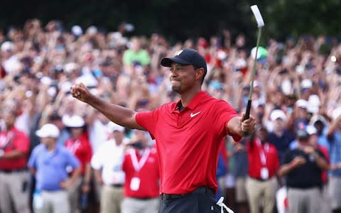 Tiger Woods of the United States celebrates making a par on the 18th green to win the TOUR Championship at East Lake Golf Club on September 23, 2018 in Atlanta, Georgia - Credit: Getty Images