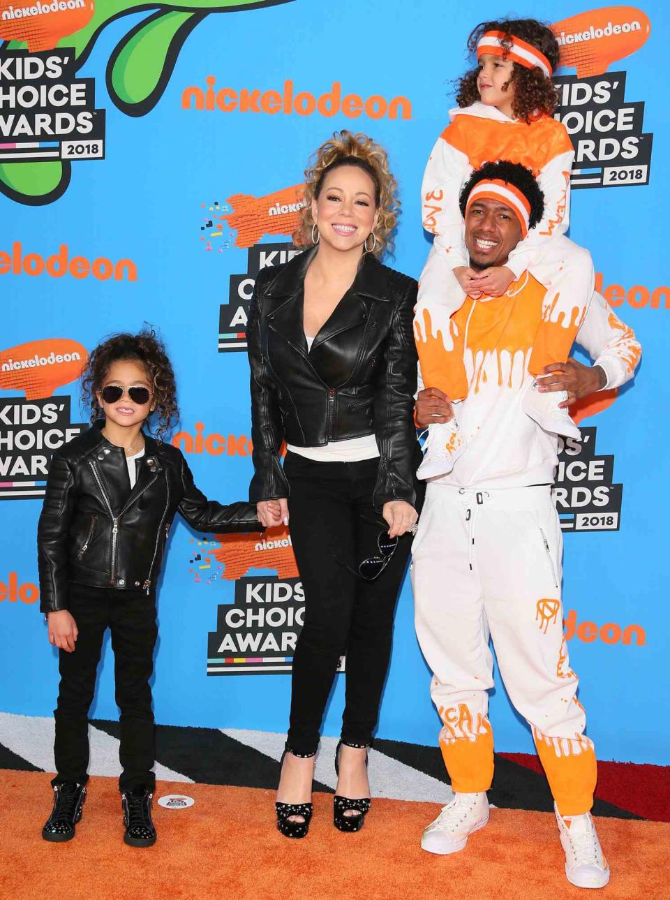 Mariah Carey and Nick Cannon arrive with children Monroe Cannon (L) and Moroccan Scott Cannon (top) at the 31st Annual Nickelodeon Kids' Choice Awards on March 24, 2018 at the Forum in Inglewood, California