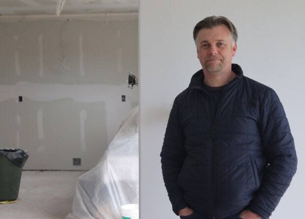 Joe McGrath and his wife have been making do with a renovation that remains unfinished. Construction costs soared after they locked down plans to take advantage of a provincial rebate program.  (Kyle Mooney/CBC - image credit)