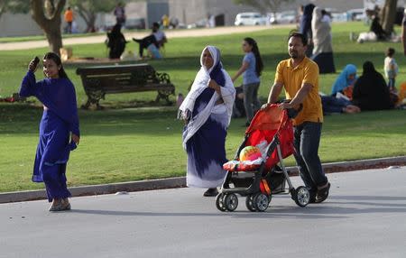 Visitors walk at Aspire Park in Doha, Qatar April 8, 2016. REUTERS/Naseem Zeitoon