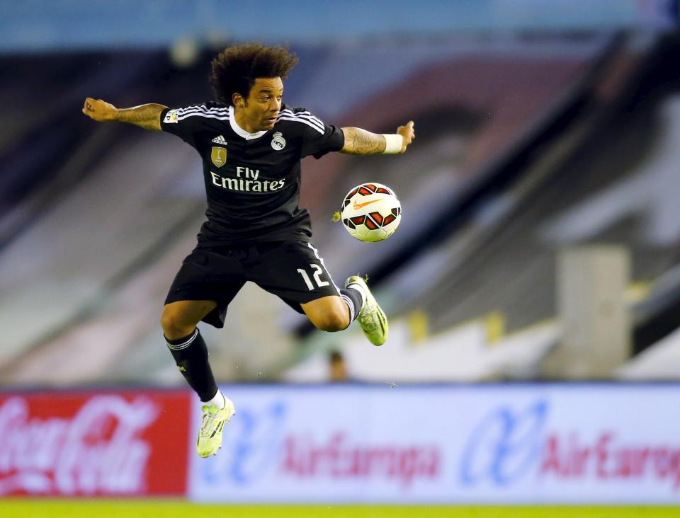 Real Madrid's Marcelo Vieira tries to control the ball during their Spanish first division soccer match against Celta Vigo at Balaidos stadium in Vigo April 26, 2015. REUTERS/Miguel Vidal