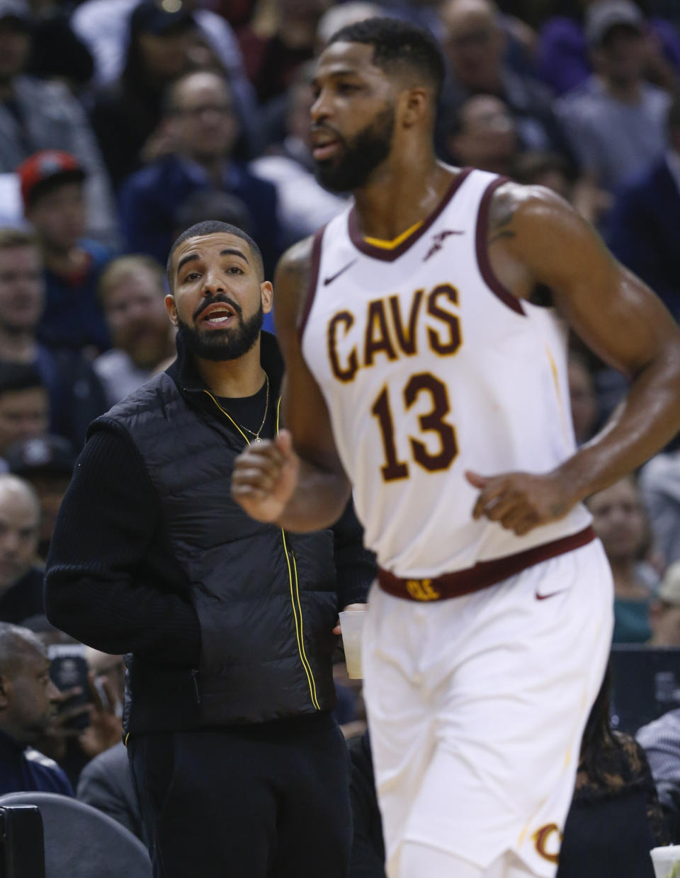 Drake has some words for Cleveland Cavaliers center Tristan Thompson (13) who returns to the court after a timeout. Toronto Raptors vs Cleveland Cavaliers in 1st half action of NBA regular season play at Air Canada Centre. - Credit: Rick Madonik/Toronto Star via Getty Images