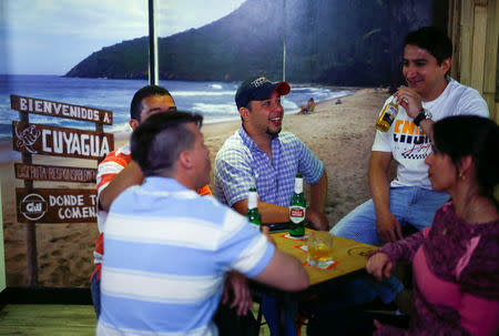 Venezuelan residents in Spain gather at the QW Bar in Madrid, Spain, May 15, 2018. REUTERS/Javier Barbancho