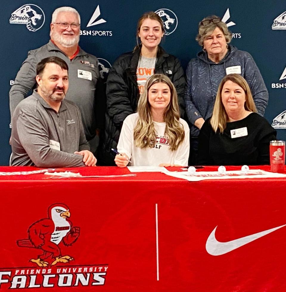 PRICE OF SUCCESS: Bartlesville High golfer Taylor Price, seated center, is headed to played colllege links at Friends (Kan.) University in Wichita, Kan. Standing in the back row, from left, is Paul Howe (Friends coach), Sydney Price (sister) and and their grandma. Also seated are  Dean and Deana Price.