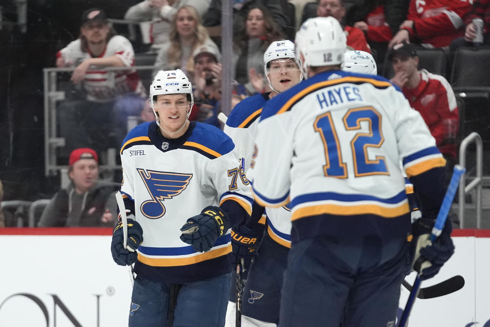 St. Louis Blues center Zachary Bolduc, left, celebrates his goal against the Detroit Red Wings in the second period of an NHL hockey game Saturday, Feb. 24, 2024, in Detroit. (AP Photo/Paul Sancya)