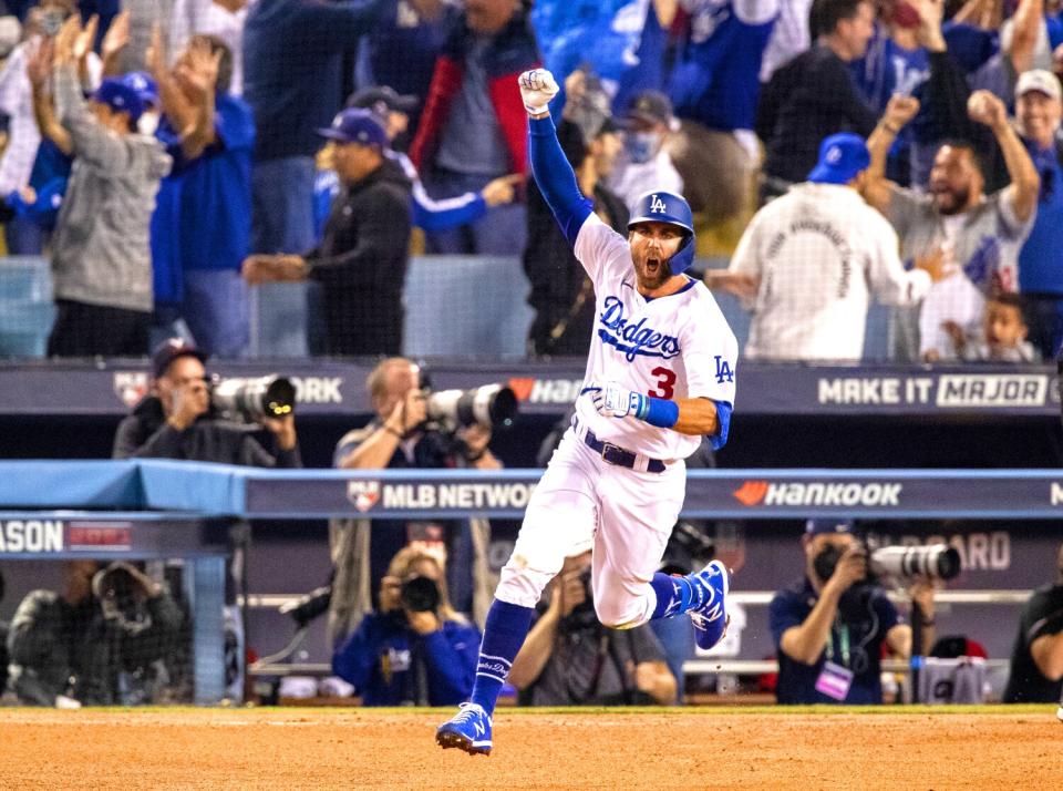 Chris Taylor celebrates after hitting a walk-off home run against the St. Louis Cardinals.