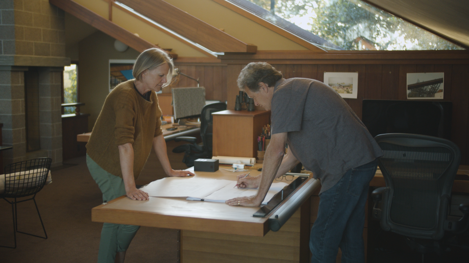 Amy Nielsen and Richard Schuh review a design in their home.