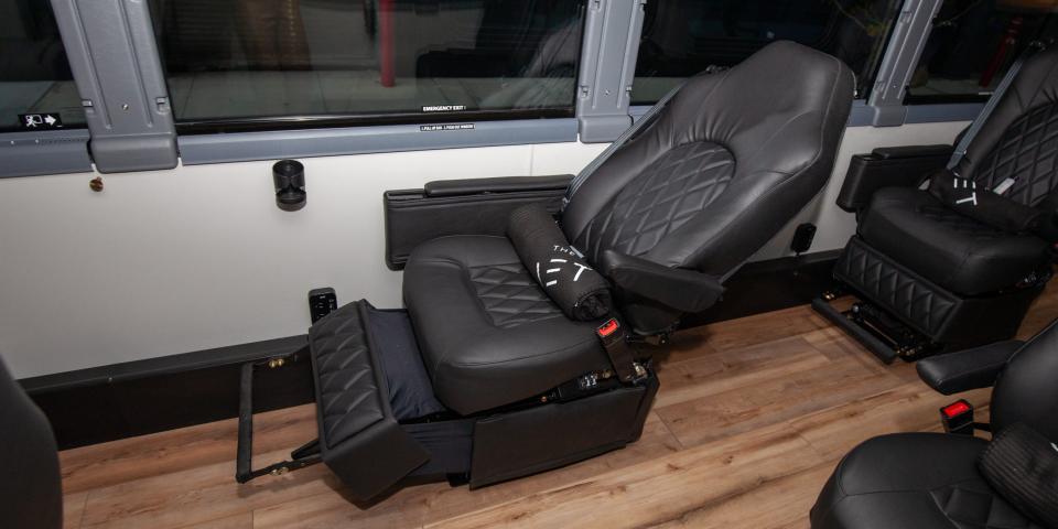 a reclined single seat with the foot rest up