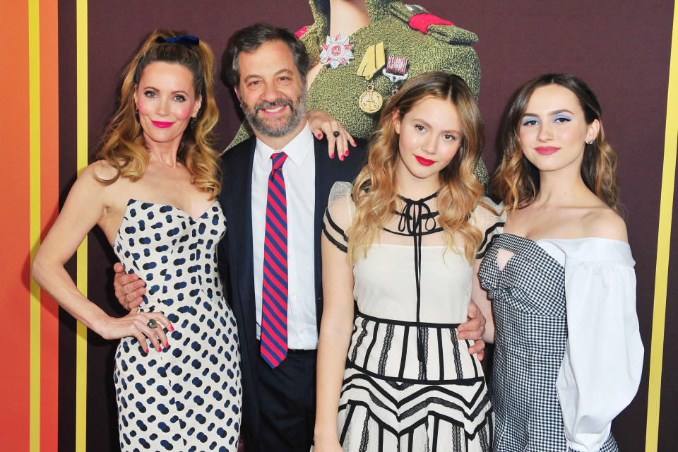 Mann with husband Judd Apatow and their daughters, Iris (left) and Maude (right).