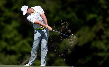 May 9, 2015; Ponte Vedra Beach, FL, USA; Rory McIlroy hits his approach to the 14th hole during the third round of The Players Championship golf tournament at TPC Sawgrass - Stadium Course. Mandatory Credit: Jake Roth-USA TODAY Sports