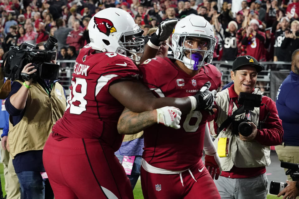 Arizona Cardinals running back James Conner (6) celebrates his touchdown with offensive tackle Kelvin Beachum against the Tampa Bay Buccaneers during the second half of an NFL football game, Sunday, Dec. 25, 2022, in Glendale, Ariz. (AP Photo/Darryl Webb)