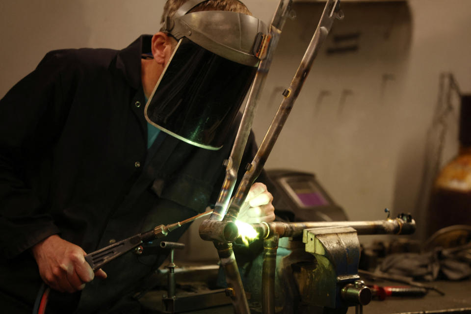 UK manufacturers: A worker assembles a new bike frame at the Pashley bicycle factory in Stratford-upon-Avon